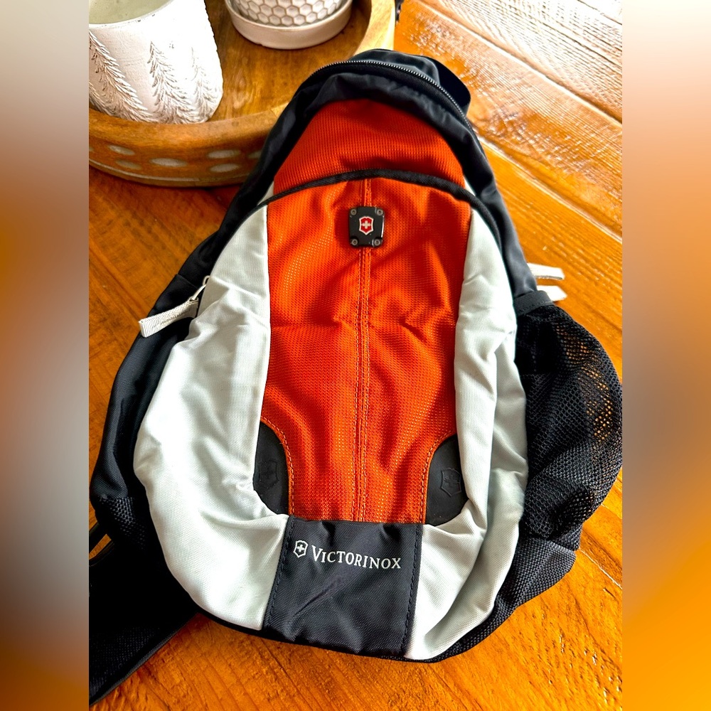Small Victorinox crossbody bag,orange, black, grey.
